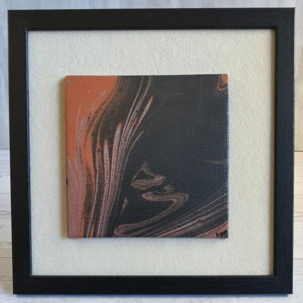 Framed acrylic pour painting, black and burnt orange abstract with metallic copper and silver streaks, 5x5 canvas on cream felt in black wood-grain frame, front view