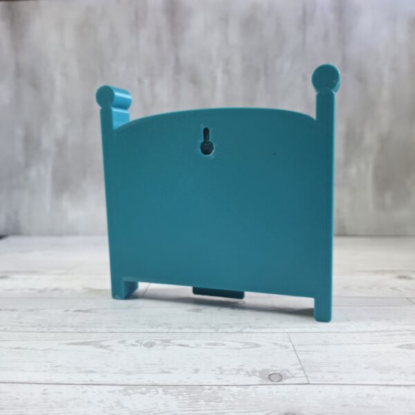 20261020_153146 Crib-shaped nursery shadow box in teal, back view with keyhole wall-hanging slot