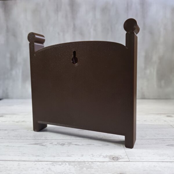 20261020_153259 Crib-shaped nursery shadow box in brown, back view with keyhole wall-hanging slot