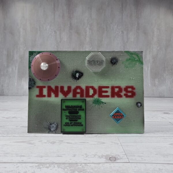 20261022_054006 Invaders canvas, green with red lettering, front view
